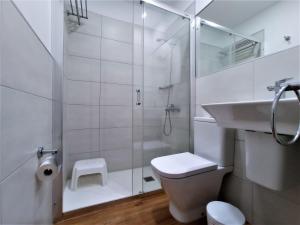 a bathroom with a shower and a toilet and a sink at Atlantic Apartments in Las Palmas de Gran Canaria +86 photos