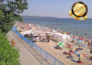 a crowded beach with a large crowd of people at Pension Dicev in Obzor