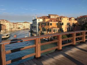 a view from a bridge over a river with buildings at Venice Homes & Holidays in Venice