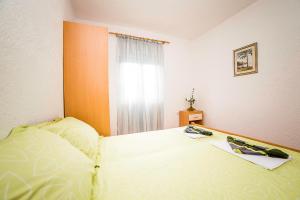 Postel nebo postele na pokoji v ubytování Apartments Bakula 1539