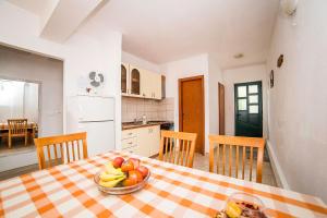Kuchyň nebo kuchyňský kout v ubytování Apartments Bakula 1539