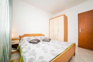Postel nebo postele na pokoji v ubytování Apartments Bakula 1539