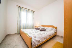 Postel nebo postele na pokoji v ubytování Apartments Bakula 1539