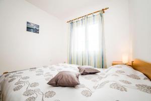 Postel nebo postele na pokoji v ubytování Apartments Bakula 1539