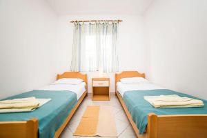 Postel nebo postele na pokoji v ubytování Apartments Bakula 1539