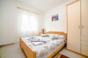 Postel nebo postele na pokoji v ubytování Apartments Bakula 1539