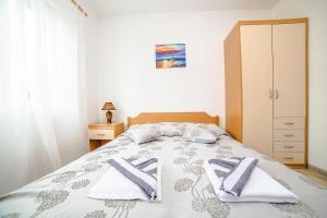 Postel nebo postele na pokoji v ubytování Apartments Bakula 1539