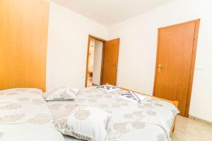 Postel nebo postele na pokoji v ubytování Apartments Bakula 1539