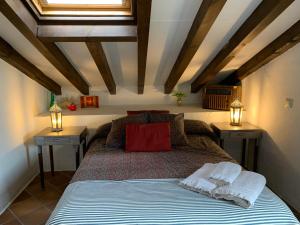 a bedroom with a large bed with two night stands at El Pósito in Hita