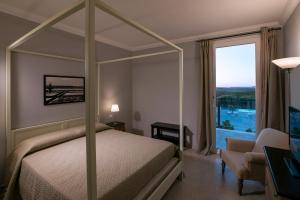 Ένα ή περισσότερα κρεβάτια σε δωμάτιο στο Corte Olea Resort