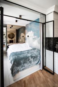 Ένα ή περισσότερα κρεβάτια σε δωμάτιο στο Apartament Gold 300 m do Plaży - Praia Apartments Sopot