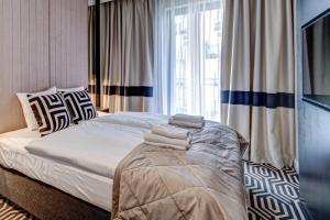Posteľ alebo postele v izbe v ubytovaní Apartamenty Baltic Fort - visitopl