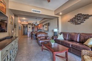 a living room with a couch and a table at Las Palomas 2BR GROUND FLOOR Huge Patio/Closest to Lazy River/Steps to Beach in Puerto Peñasco