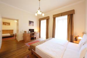 Postel nebo postele na pokoji v ubytování Hotel Historia & Historante