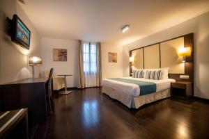 Cama o camas de una habitación en Occidental Pueblo Acantilado
