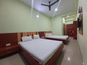 Hotel Shree Hari客房内的一张或多张床位