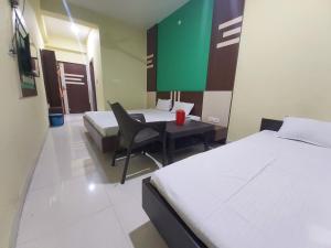 Hotel Shree Hari客房内的一张或多张床位