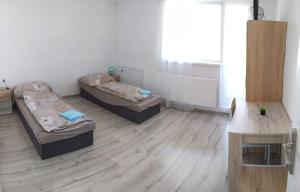 Posteľ alebo postele v izbe v ubytovaní Ubytovanie v súkromí Dalica s.r.o.