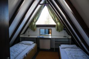 Voodi või voodid majutusasutuse Haus 4-Jahreszeiten toas