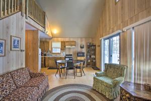 A seating area at Secluded Irons Cabin with 5-Acre Yard, Deck, Grill!