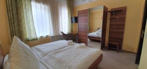 Ein Bett oder Betten in einem Zimmer der Unterkunft Restaurant & Hotel Olive