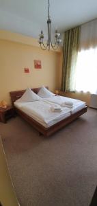 Ein Bett oder Betten in einem Zimmer der Unterkunft Restaurant & Hotel Olive