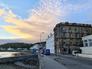 a city street with a building and a street light at The Editor's Choice, Oban seafront apartment in Oban