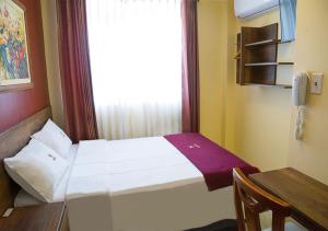 Postel nebo postele na pokoji v ubytování Hotel Central