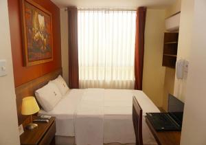 Postel nebo postele na pokoji v ubytování Hotel Central