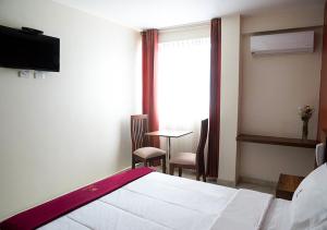 Postel nebo postele na pokoji v ubytování Hotel Central