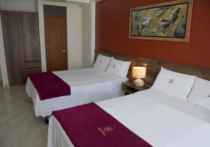 Postel nebo postele na pokoji v ubytování Hotel Central