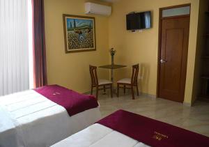 Postel nebo postele na pokoji v ubytování Hotel Central