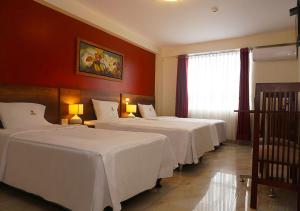 Postel nebo postele na pokoji v ubytování Hotel Central