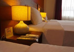 Postel nebo postele na pokoji v ubytování Hotel Central