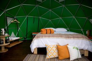 Postel nebo postele na pokoji v ubytování Samaná Ecohabs Glamping