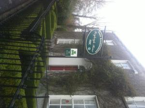 a building with a sign on the side of it at Ivyleigh House in Portlaoise