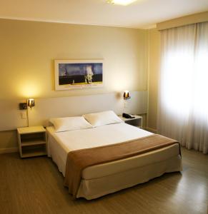 Postel nebo postele na pokoji v ubytování Charrua Hotel