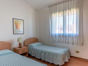 a room with two beds and a window at Villa in Albarella near Venice Beach in Isola Albarella +34 photos