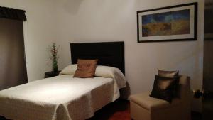 En eller flere senger på et rom på Casa Guelaguetza By Rotamundos