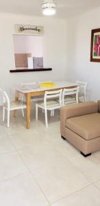 a living room with a table and a couch at Jenaz in Federación