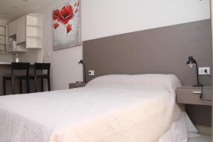 Ліжко або ліжка в номері Bonaire V apartamento 2 Personas a 1 cuadra de la costanera