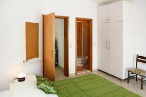 Postel nebo postele na pokoji v ubytování Apartments Davor & Marija Sosic