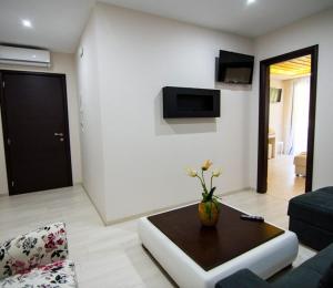 a living room with a couch and a table at Archontiko Liamas in Stavros