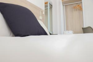 Postel nebo postele na pokoji v ubytování Hotel Sunna Benicassim