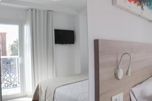 Postel nebo postele na pokoji v ubytování Hotel Sunna Benicassim