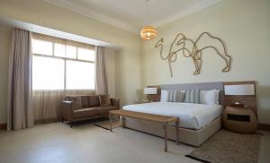 Voodi või voodid majutusasutuse Liwa Hotel toas