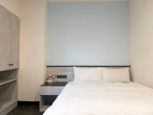 Voodi või voodid majutusasutuse Raise Hotel Taichung toas