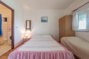 Posteľ alebo postele v izbe v ubytovaní Apartments Blaženka