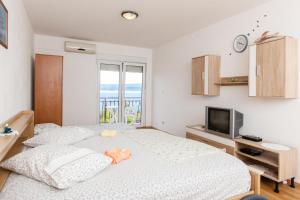 Posteľ alebo postele v izbe v ubytovaní Apartments Blaženka