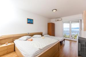 Posteľ alebo postele v izbe v ubytovaní Apartments Blaženka
